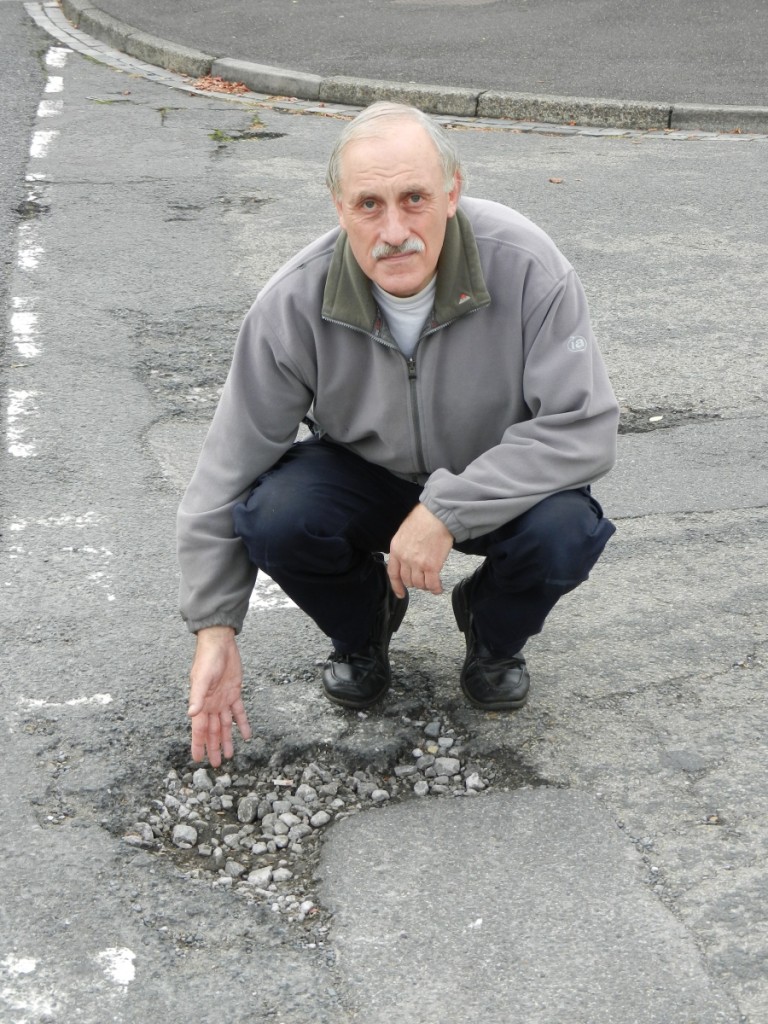 Clive Baskerville campaigning for the many pot holes to be filled